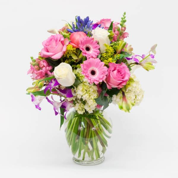 Pink and white mixed bouquet in a clear glass vase