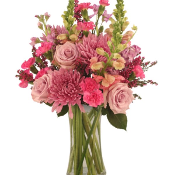 Pink roses and chrysanthemums in a clear glass vase