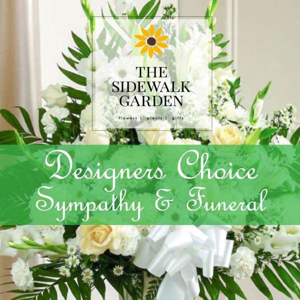 White floral sympathy arrangement with roses and lilies