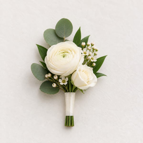 White boutonniere with two roses and greenery