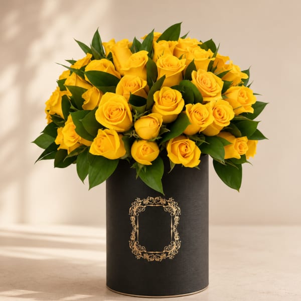 Yellow roses arranged in a black cylindrical box