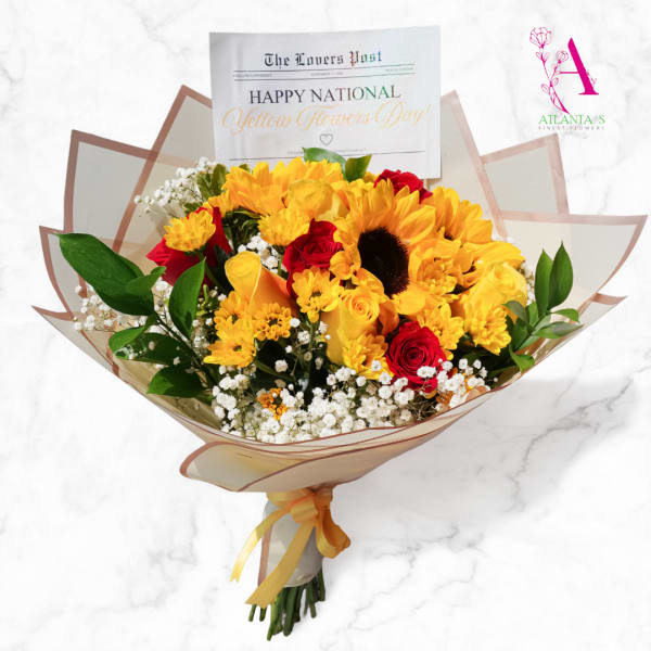 Bouquet of yellow sunflowers and red roses wrapped in paper