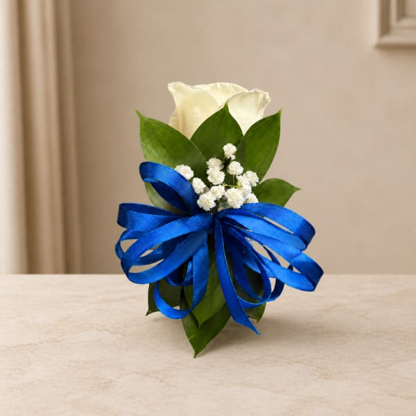 White calla lily arrangement with a blue ribbon bow