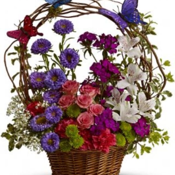 Colorful flower basket with purple daisies, pink roses, and white lilies