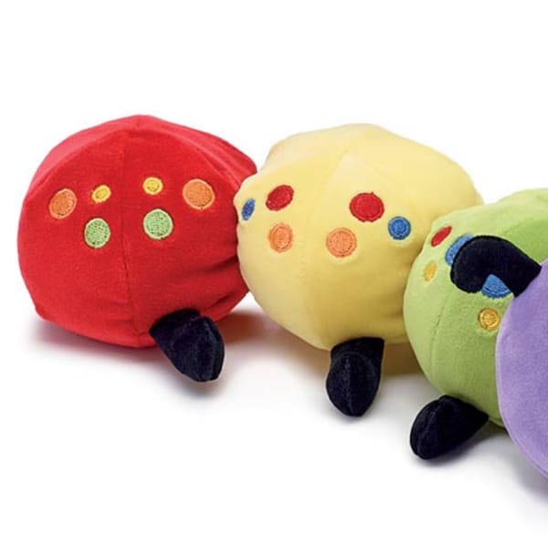 Four colorful plush caterpillar toys with smiling faces