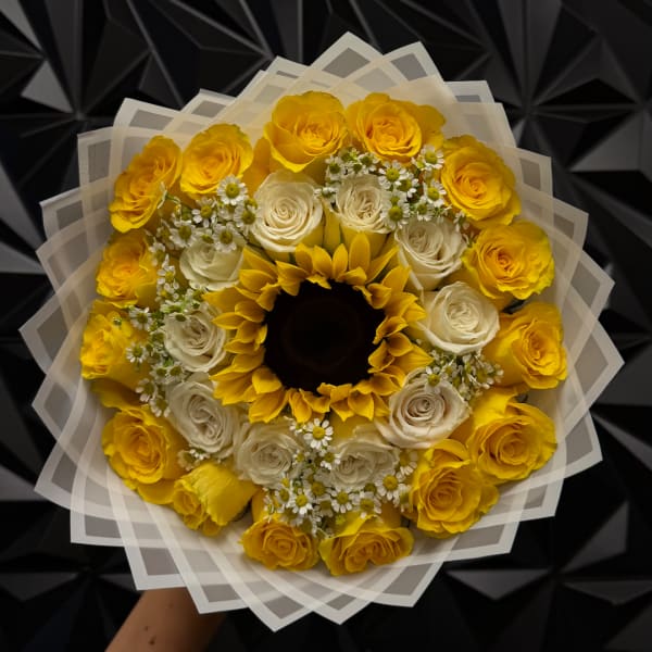 Yellow and white rose bouquet with a sunflower center