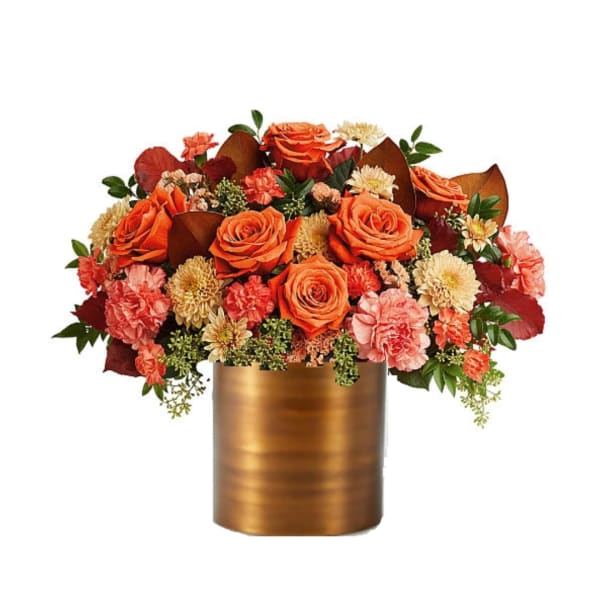 Orange roses and pink carnations in a gold vase