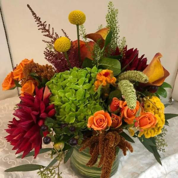 Colorful mixed flower arrangement in a glass vase