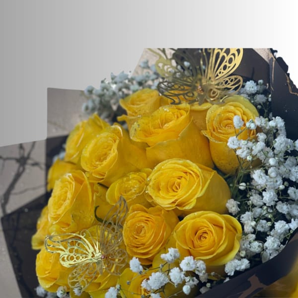 Bouquet of yellow roses with white baby's breath and butterfly picks