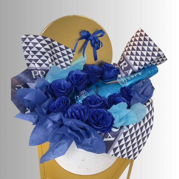 Blue rose bouquet with a champagne bottle and patterned wrap