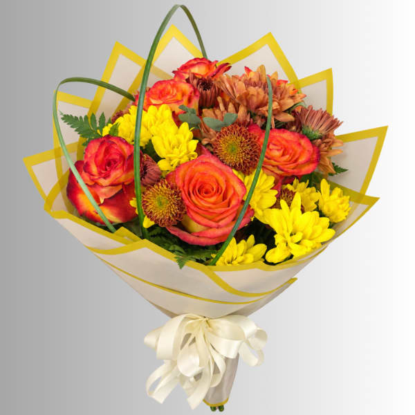 Bouquet of orange roses and yellow chrysanthemums wrapped in cream paper