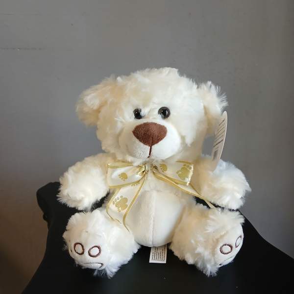 White plush teddy bear with a gold ribbon bow
