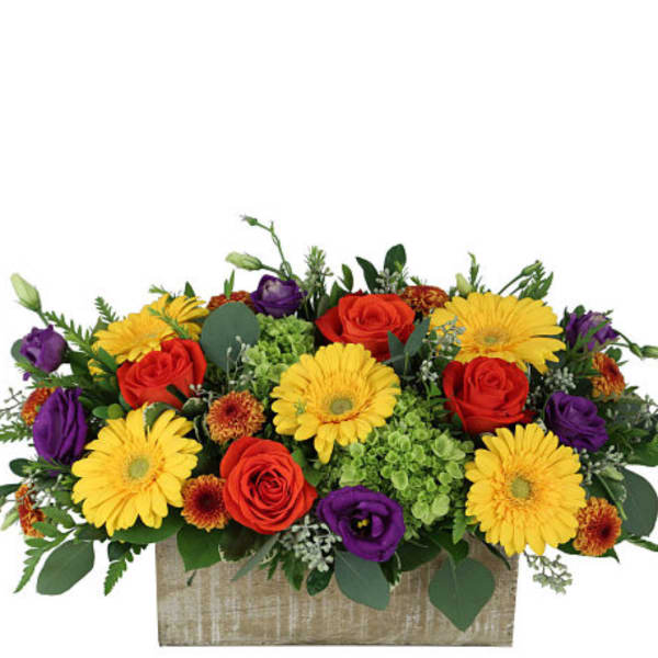 Colorful flower arrangement in a rectangular wooden box