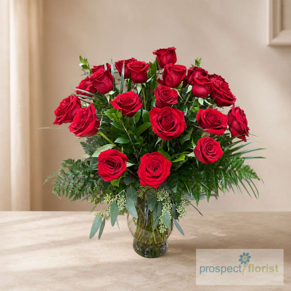 Bouquet of red roses in a clear glass vase