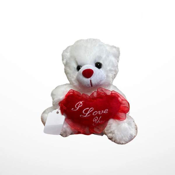 White teddy bear holding a red heart with "I Love You" text