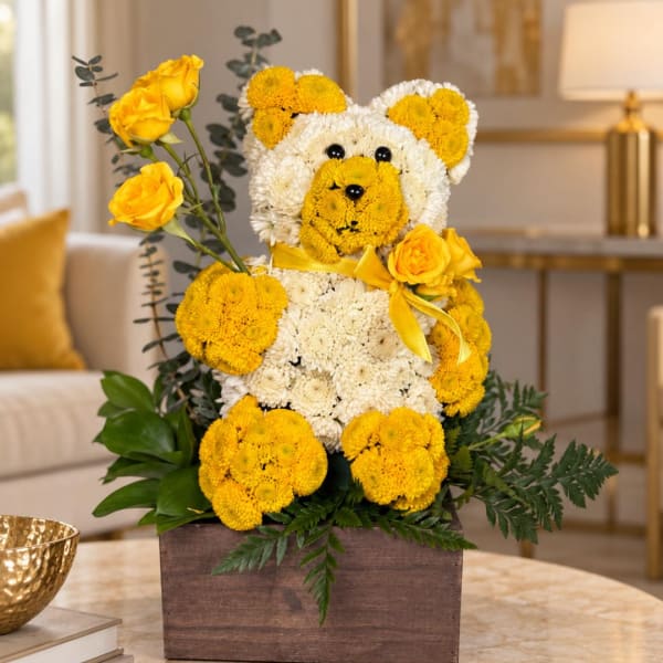 Yellow and white flower teddy bear in a wooden box with roses