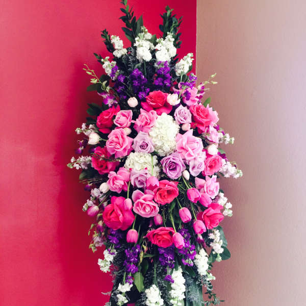 Tall standing floral spray with pink, purple, and white flowers