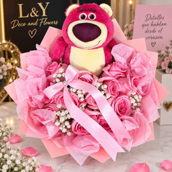 Pink rose bouquet with a plush bear and ribbon