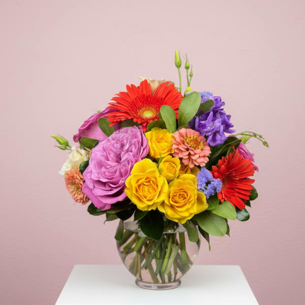 Colorful mixed bouquet in a clear glass vase