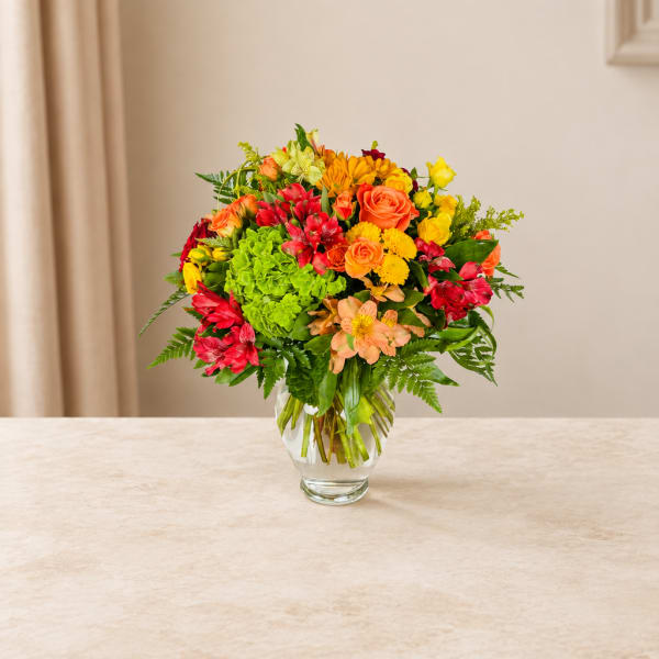 Colorful mixed bouquet in a clear glass vase
