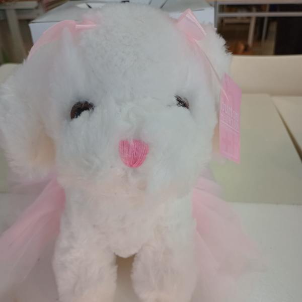 White plush bunny with pink ribbon accents and a pink nose