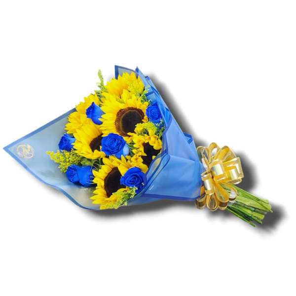 Bouquet of yellow sunflowers and blue roses wrapped in blue paper with a gold bow