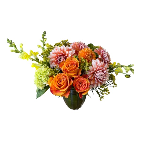 Orange roses and pink dahlias in a dark vase with yellow accents