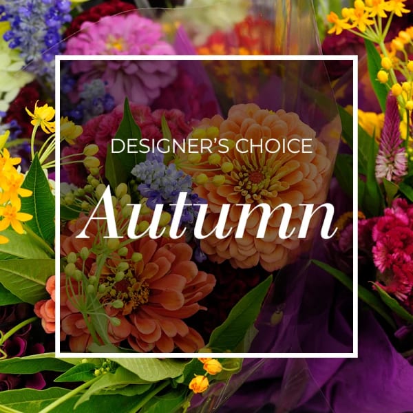 Autumn-themed bouquet with orange, pink, and yellow flowers