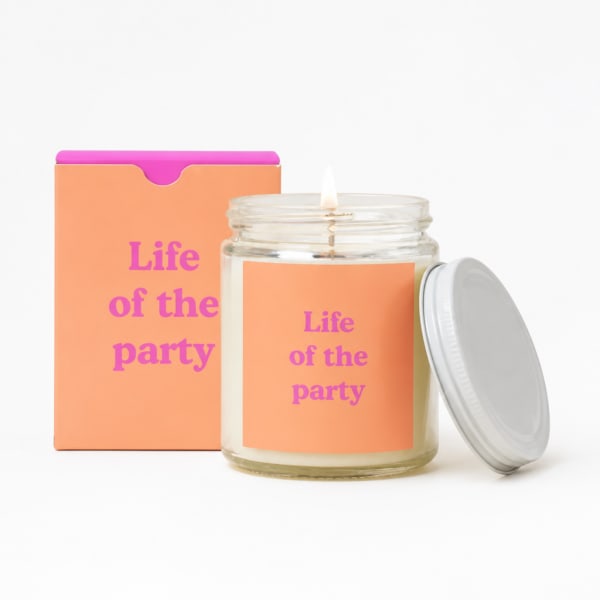 Lit candle in a glass jar with a matching box and lid
