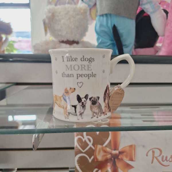 White mug with dog illustrations and the text "I like dogs more than people"