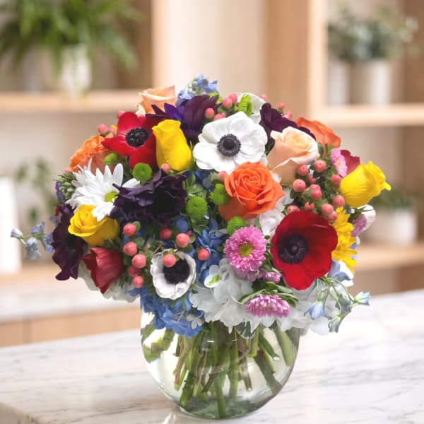 Colorful mixed bouquet in a clear glass vase