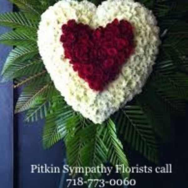 Heart-shaped floral wreath with red center and white border