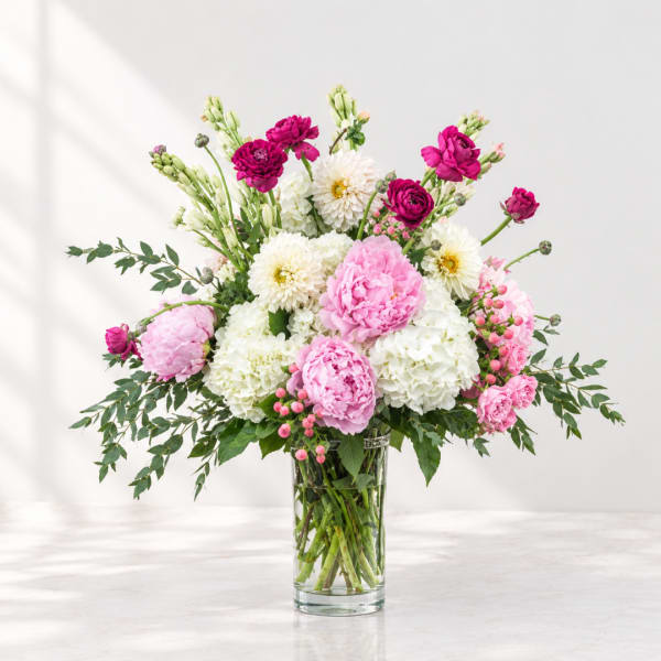 Pink and white mixed bouquet in a clear glass vase