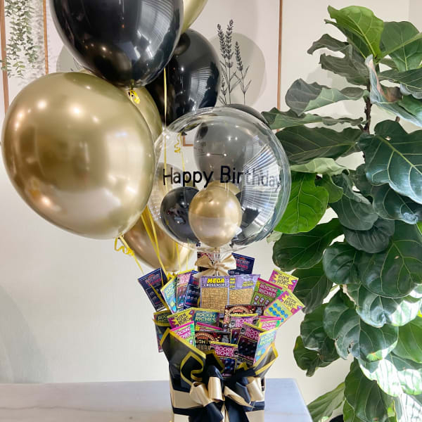 Birthday balloon bouquet with scratch-off lottery tickets in a gift box