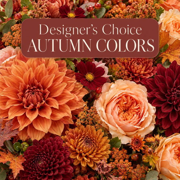 Autumn flower arrangement with orange, burgundy, and peach blooms