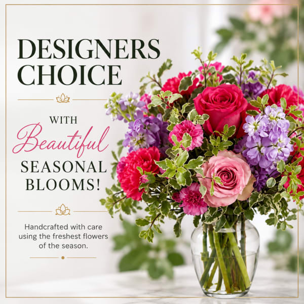 Mixed pink and purple bouquet in a clear glass vase