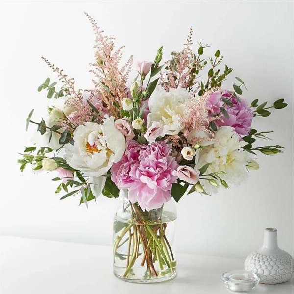 Pink and white bouquet in a clear glass vase
