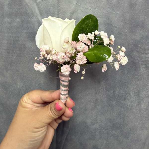 White pink boutonnière
