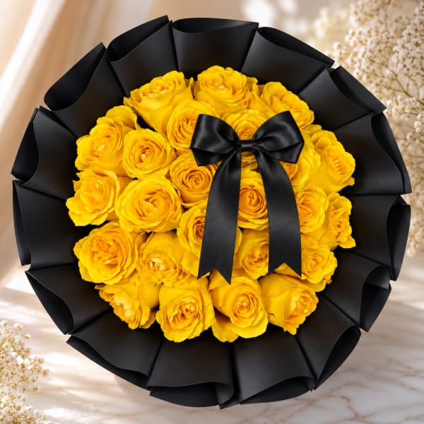 Bouquet of yellow roses wrapped in black paper with a black ribbon