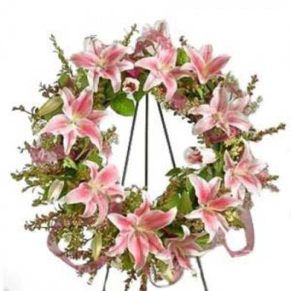Pink lily wreath on a black easel