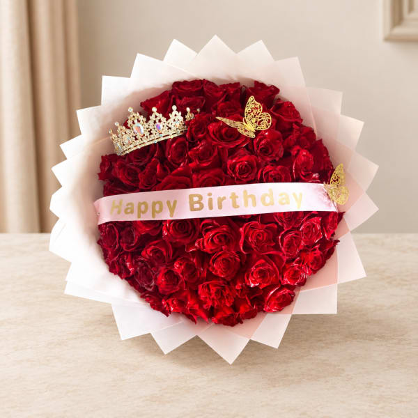 Red rose bouquet with a birthday ribbon and decorative crown