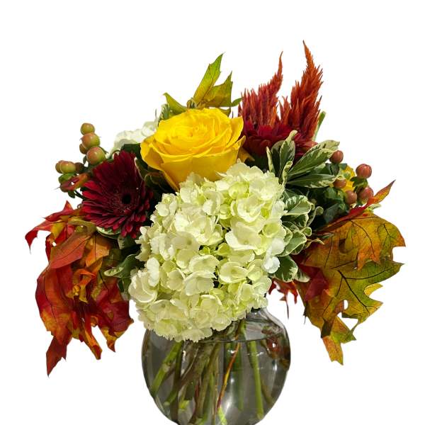 Yellow rose and white hydrangea arrangement in a glass vase