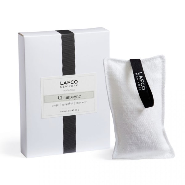 White boxed candle set with a fabric sachet labeled Lafco New York