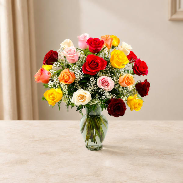 Mixed roses in a clear glass vase
