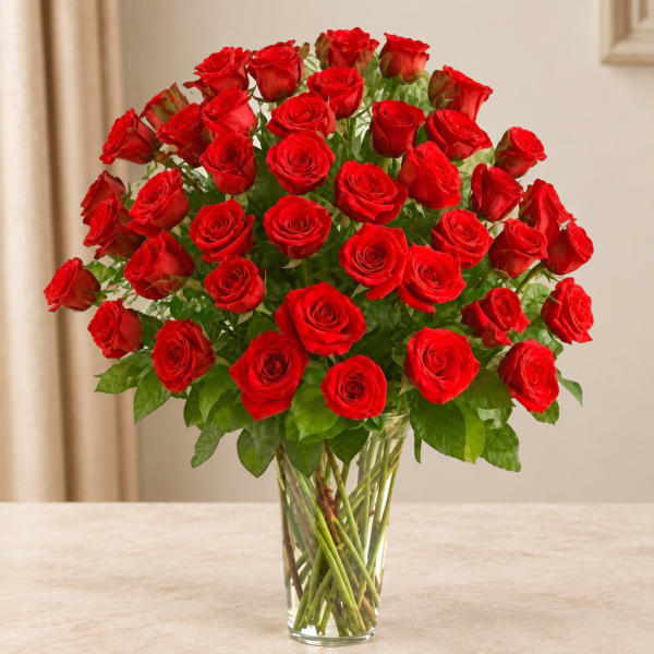 Bouquet of red roses in a clear glass vase