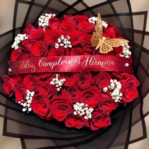 Red rose bouquet with baby's breath and a birthday ribbon