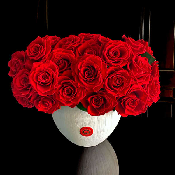 Red rose bouquet in a white vase