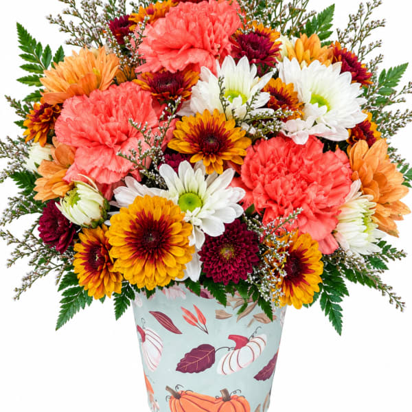 Mixed bouquet of chrysanthemums and carnations in a patterned vase