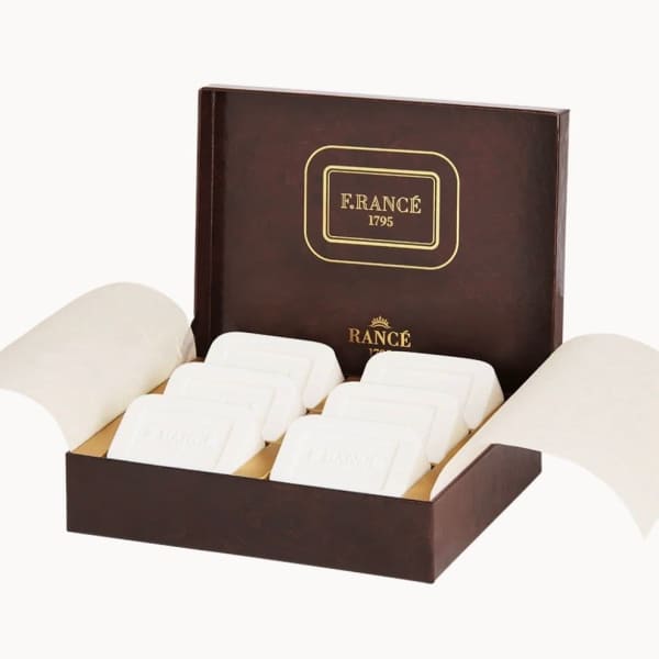 Box of white wrapped chocolates in a brown gift box