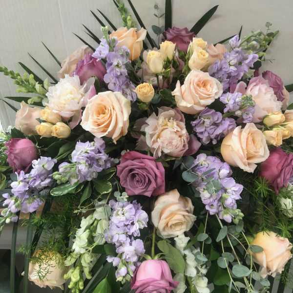 Large pastel bouquet of roses and lavender flowers